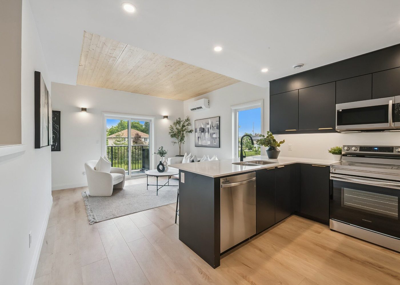 Open kitchen and living space leading to a balcony