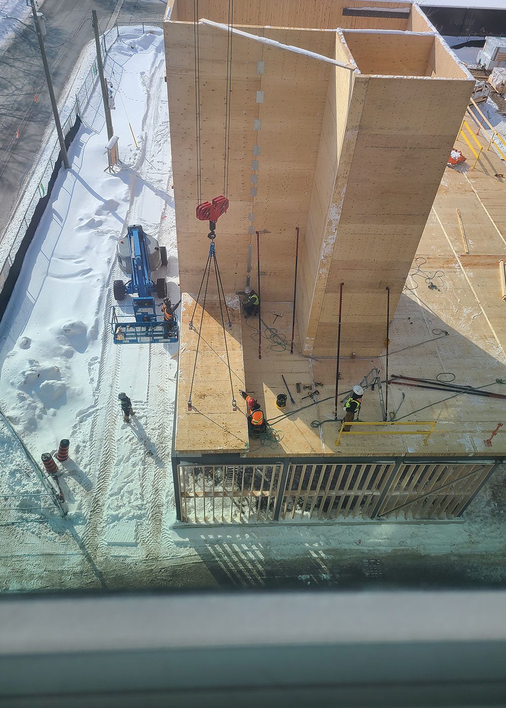 Looking down on timber walls and core during construction