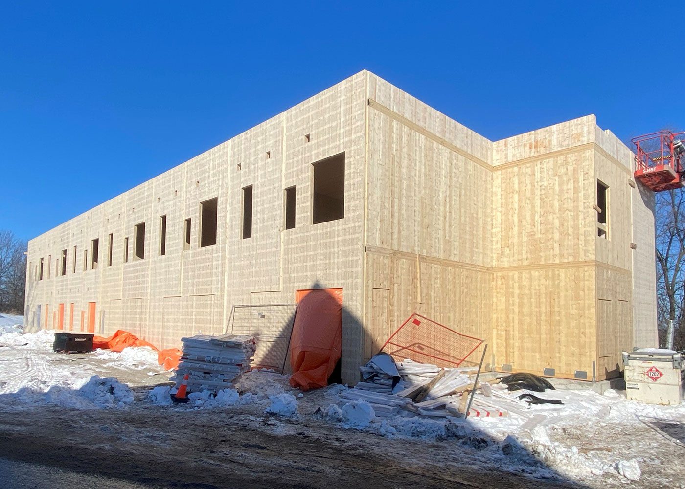 Mass timber walls and window openings during winter construction