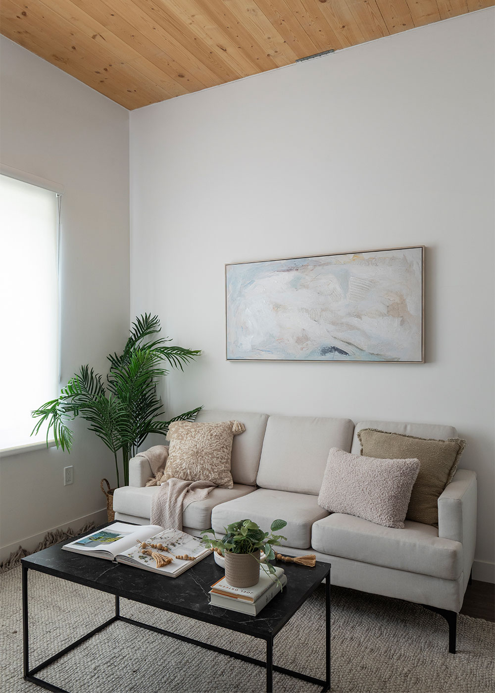 Furnished suite interior with a timber ceiling detail